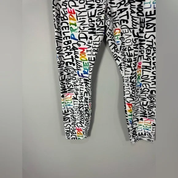 NWOT ATHLETA ELATION TRAIN 7/8
Tight Leggings PRIDE Graffiti words L - Picture 9 of 13